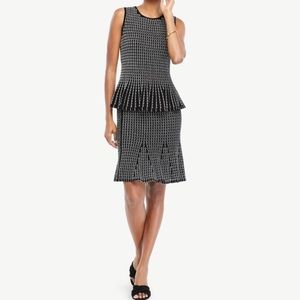 Embroidered peplum sweater and flare skirt